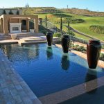 Elegant pool with multiple pot waterfeatures, golf course, fireplace and open loggia,design Dreamscapes by MGR leading pool contractor in Orange County