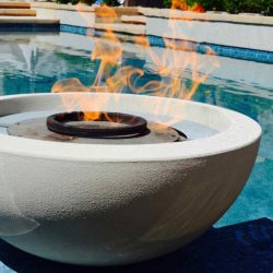 Fire pot accessory on custom column, tile spillway, Dreamscape by MGR leading pool contractor in Orange County
