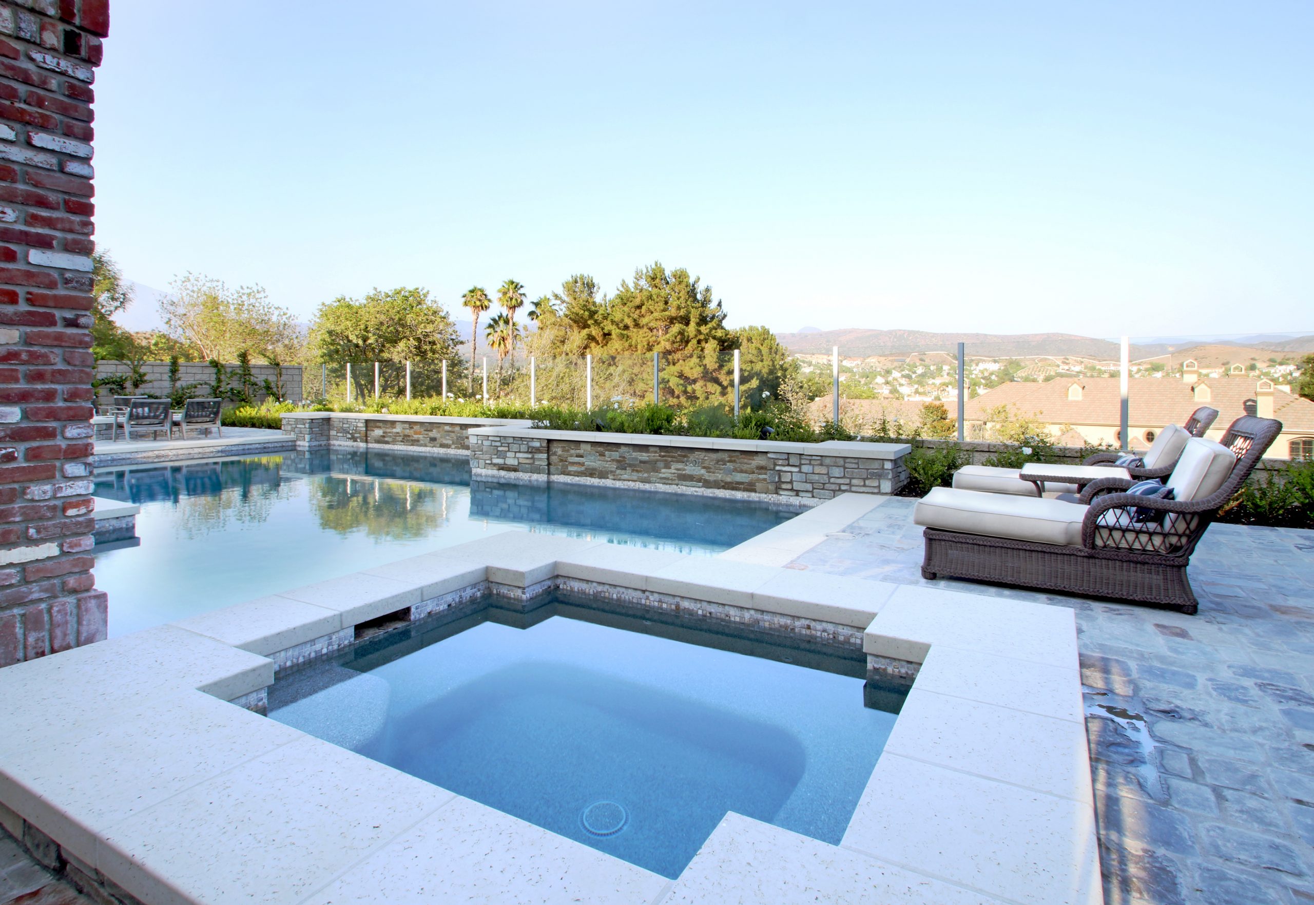 Elegant backyard layout with custom pool, stone deck, Dreamscape by MGR leading pool contractor in Orange County