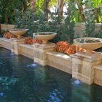 Pottery spillways into pool, Dreamscape by MGR leading pool contractor in Orange County