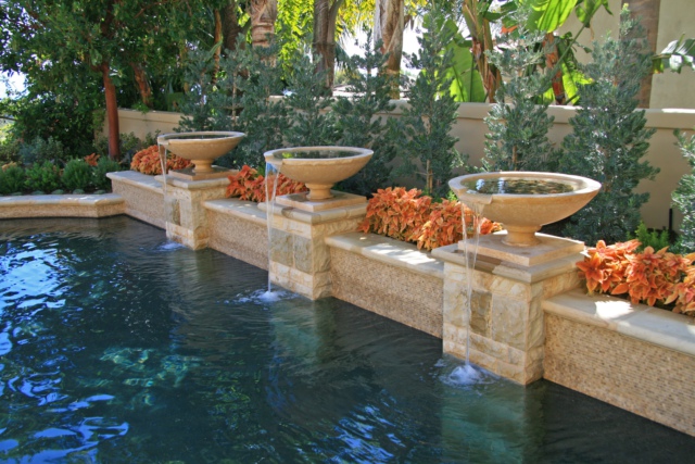 Pottery spillways into pool, Dreamscape by MGR leading pool contractor in Orange County