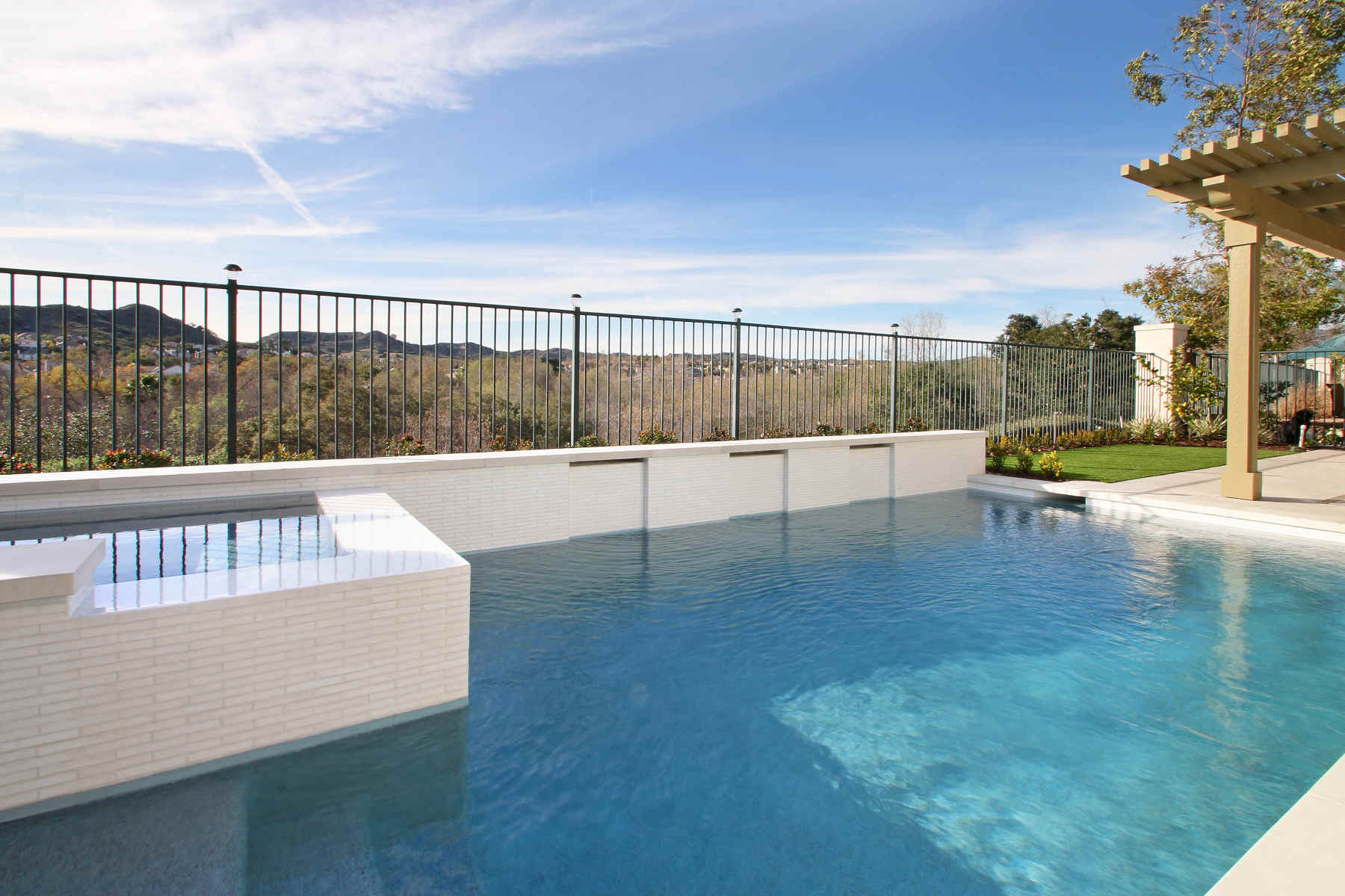 Modern pool and spa with custom tilework, Dreamscape by MGR leading pool contractor in Orange County
