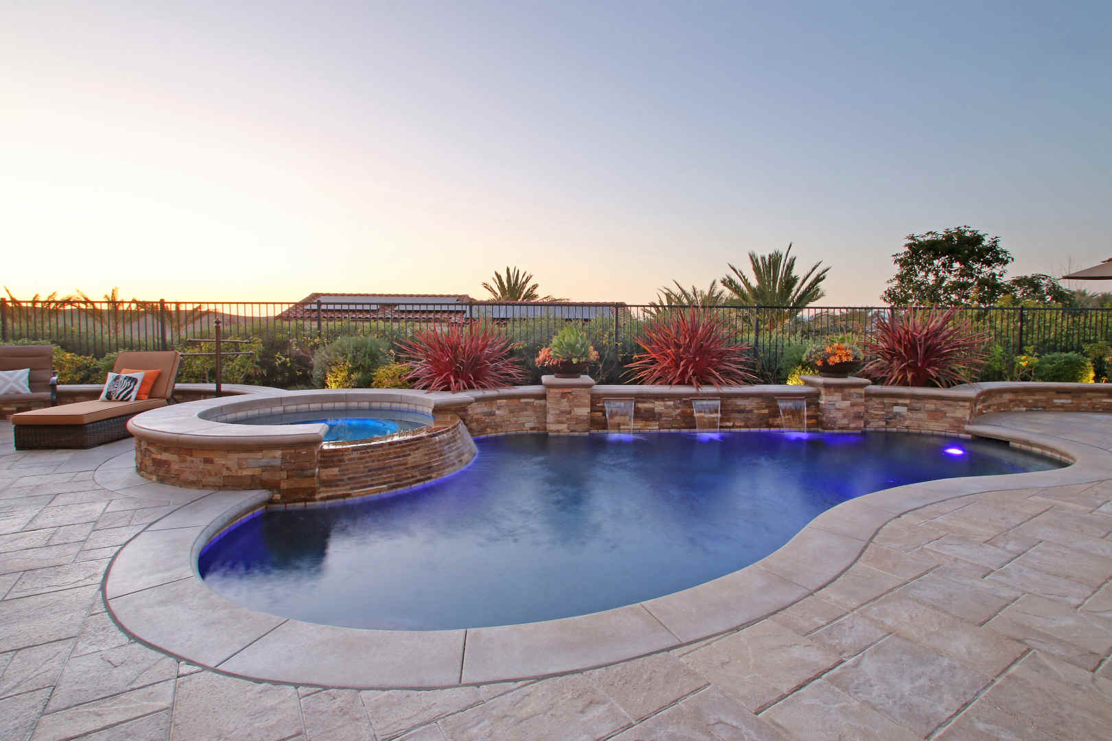 Freeform pool with stone hardscape, Dreamscape by MGR leading pool contractor in Orange County