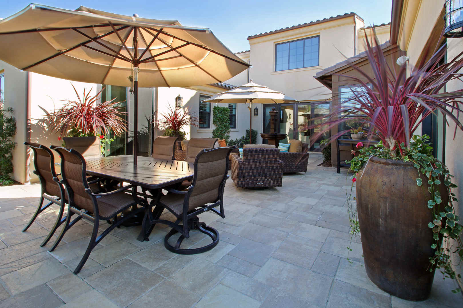 Outdoor sitting area, versailles pattern stone hardscape, Dreamscape by MGR leading pool contractor in Orange County