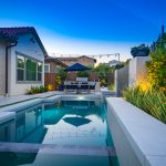 Elegant modern pool, precast coping and wall caps, turf banding, design by Dreamscape by MGR leading pool contractor in Orange County